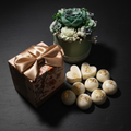 Luxury wax melts with gold leaf detail on dark slate background – Lux & Lustre
