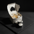 Luxury unscented tealights in white heart-window gift box on dark charcoal surface – Lux & Lustre